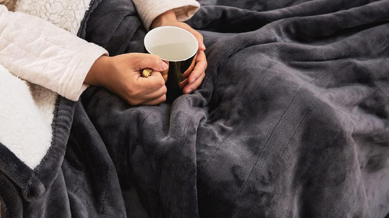 person sitting in electric blanket