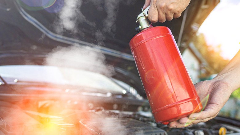 Fire extinguisher putting out engine fire