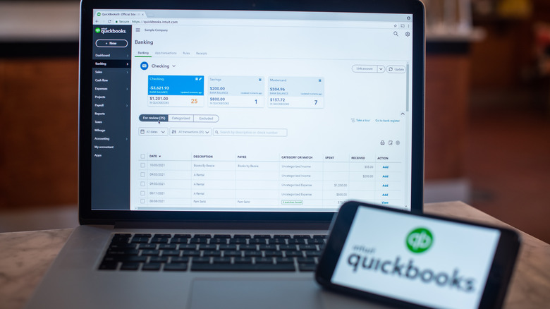 Quickbooks software on a laptop and smartphone