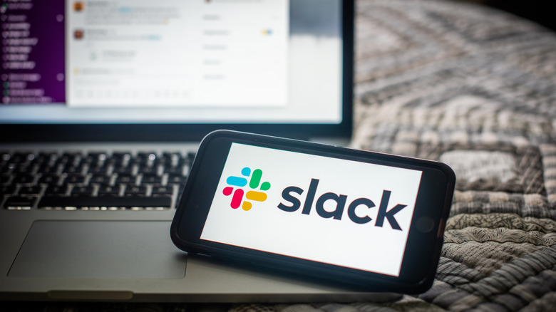 Slack running on a laptop and smartphone