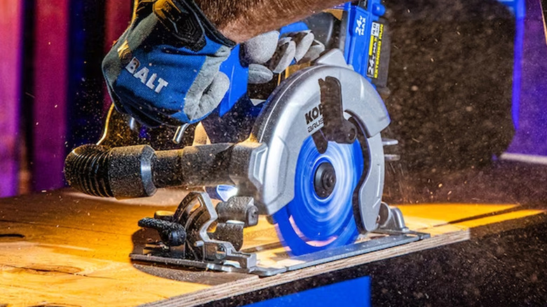 person using kobalt circular saw