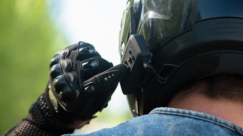 Person using Bluetooth headset on helmet