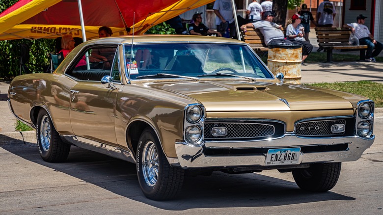 1967 gold Pontiac GTO parked