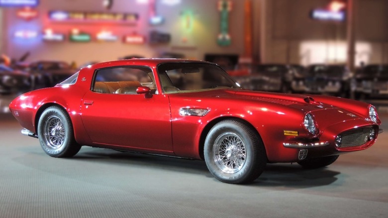 Gray Pontiac Firebird parked garage