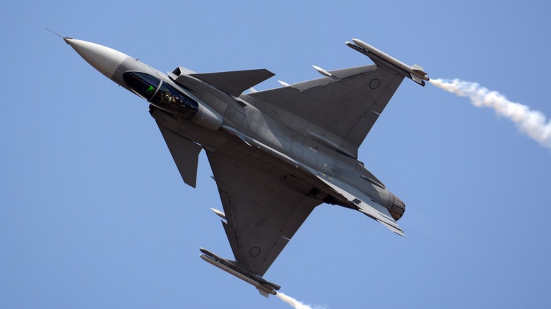 Saab Gripen with smoke trails