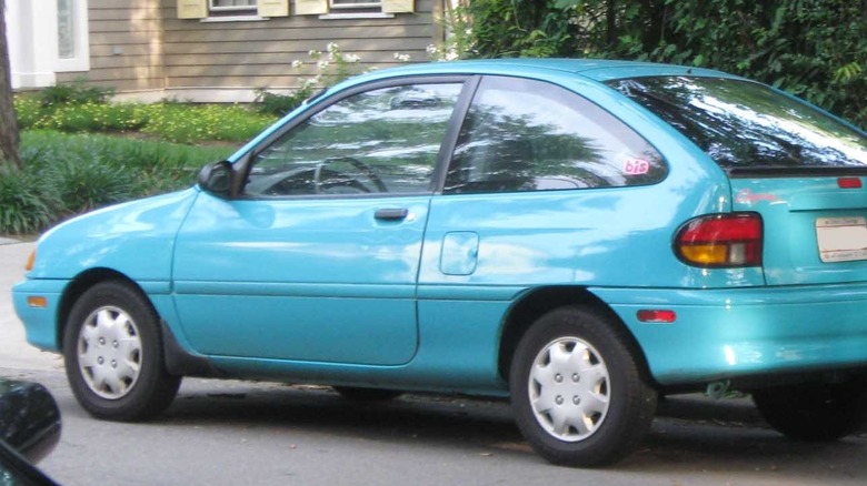 Robin's egg blue Ford Aspire parked