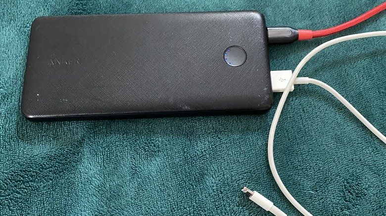 charging Anker 313 Power Bank with lightning cable