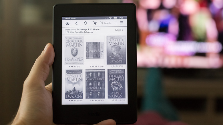 Kindle Paperwhite displaying several e-books