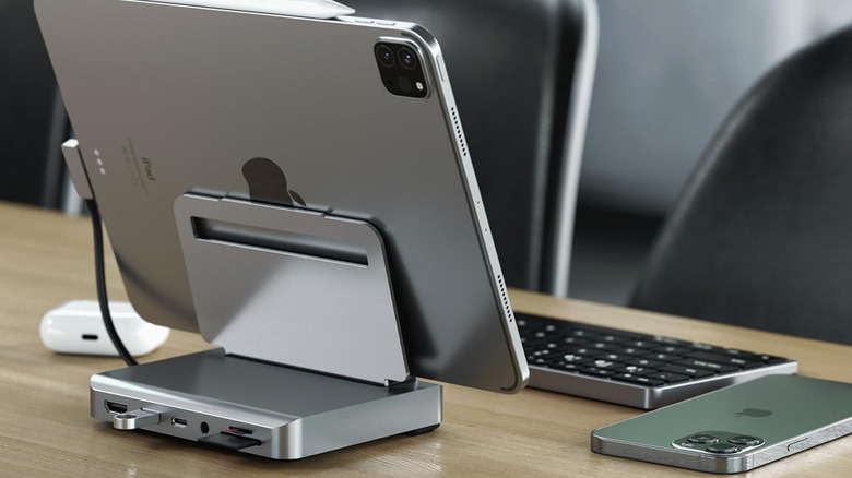 An iPad on a Satechi USB docking station sitting on an office desk