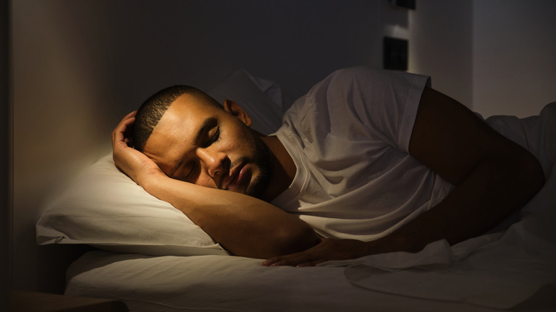 Man sleeping in bed