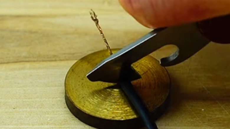 Cutting a wire with a Swiss Army Knife can opener