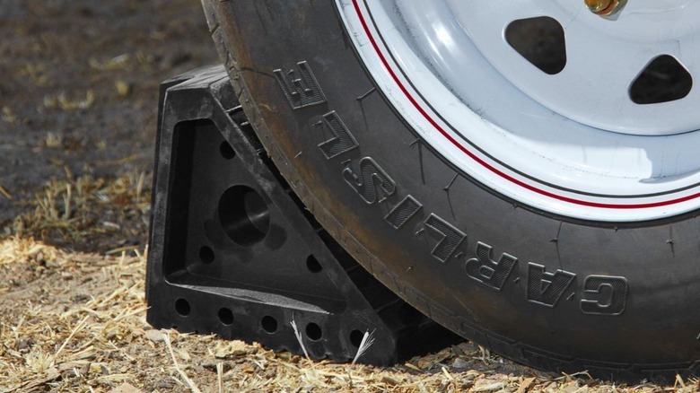 Rubber chock on the back of a wheel