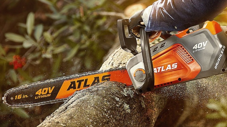 Chainsaw cutting through a log