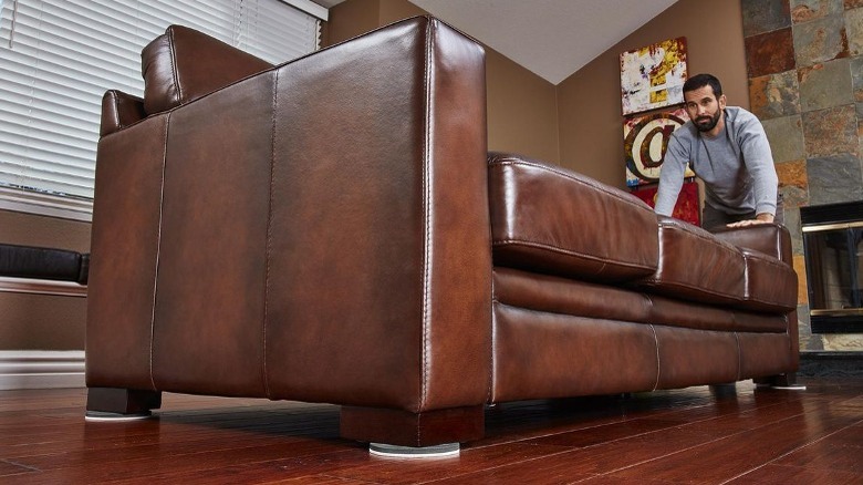 Hardwood floor sliders under couch