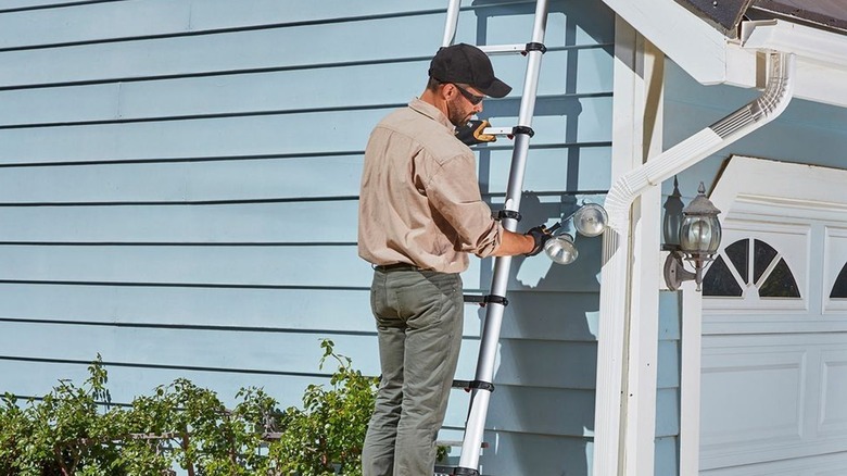 Man on Franklin telescoping ladder