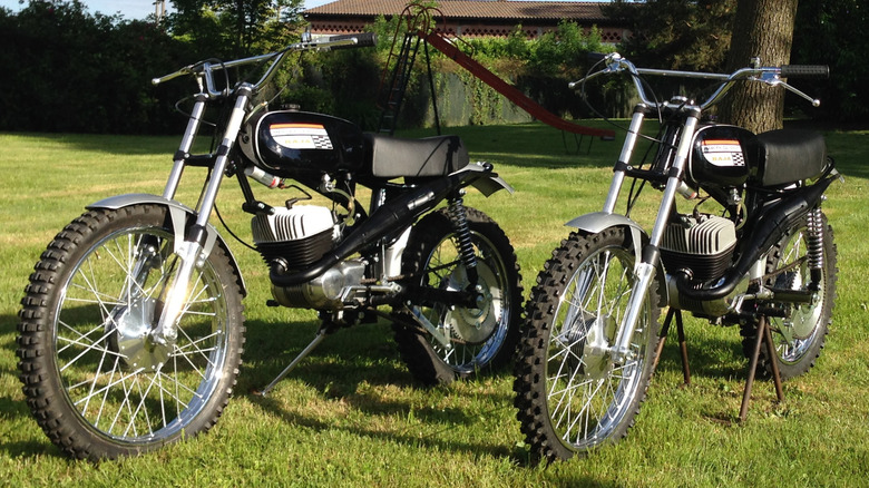 Two 1970 Harley-Davidson Baja 100 bikes parked