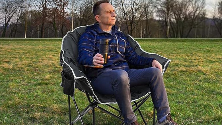 Man sitting on moon chair