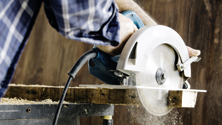 Person using circular saw