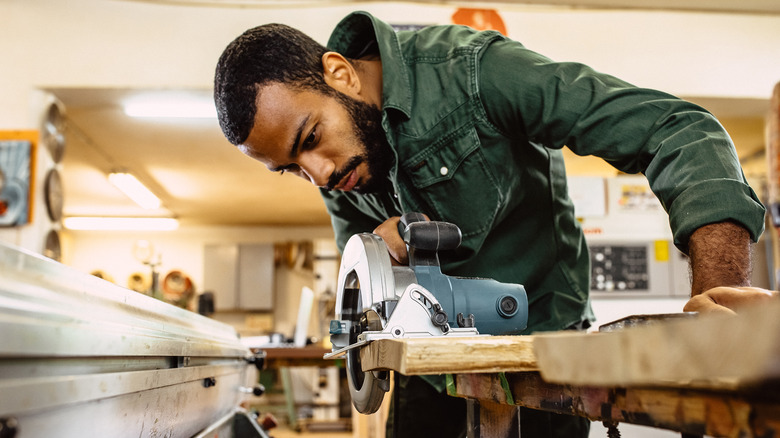 Person using circular saw