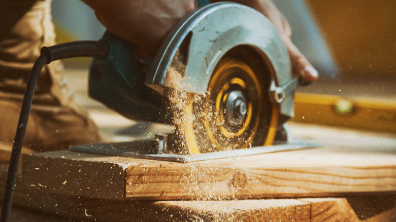 Person using circular saw