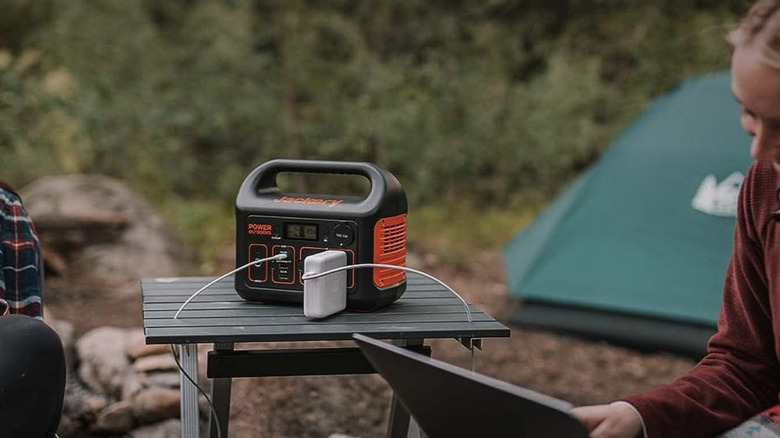 Camping couple with Jackery power station