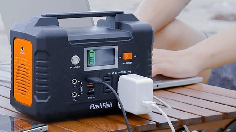 FlashFish power station powering laptop