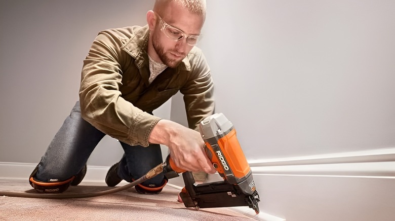 Man using Ridgid nailer