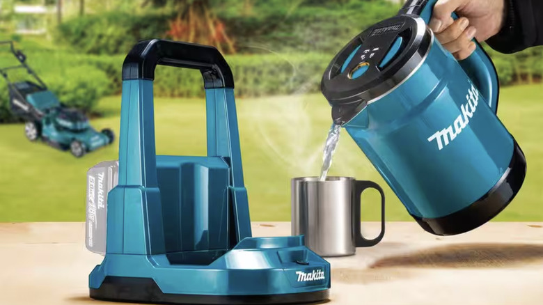 Person pouring water out of Makita kettle