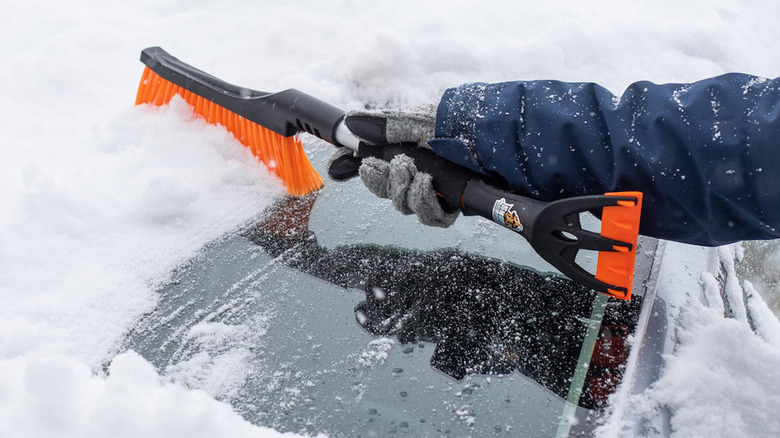 BirdRock Snow Moover brushing snow off windshield