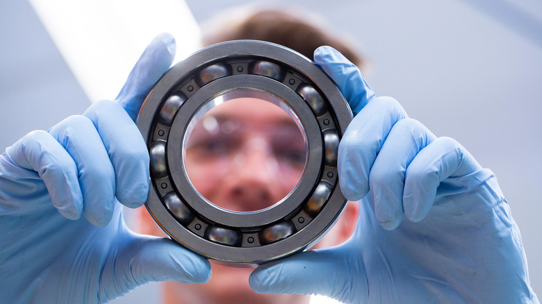 Engineer holding a vacuum's bearing ring