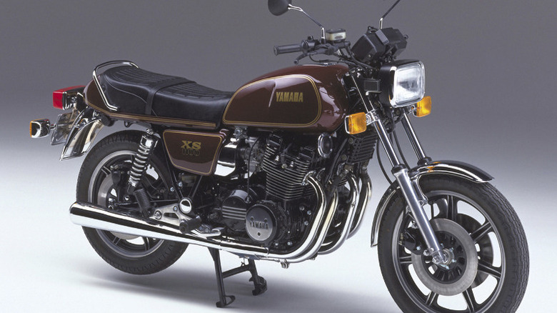 Brown Yamaha XS1100 motorcycle against grey background