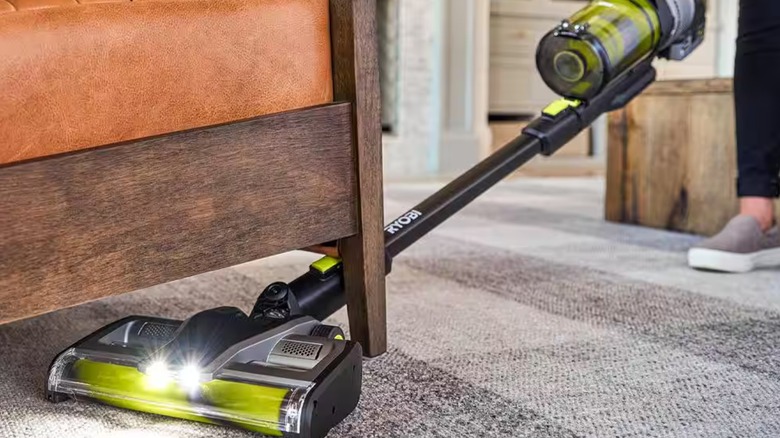 Cleaning under furniture with the Ryobi stick vacuum