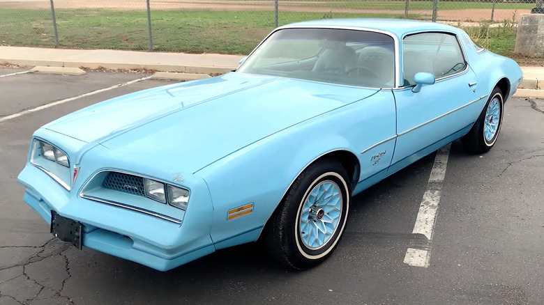 Sky Bird Pontiac Firebird parked in lot