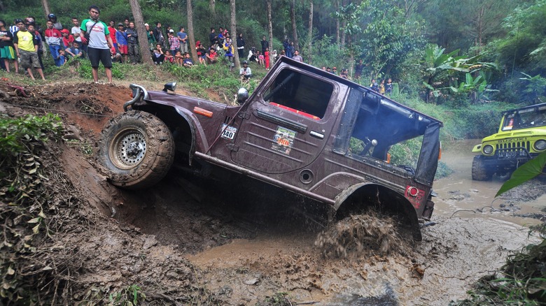 Jeeps off-roading in the mud