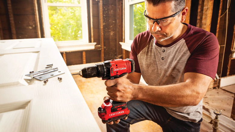 Craftsman V20 Max 1/2-inch Cordless Drill/Driver being used to build door