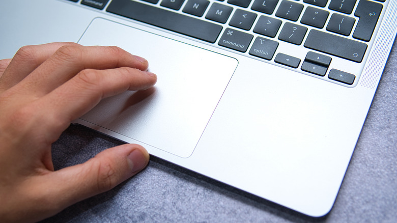 hand on a Mac trackpad