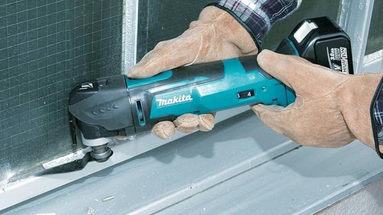 Makita oscillating tool cutting wall