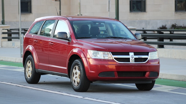 A red Dodge Journey parked