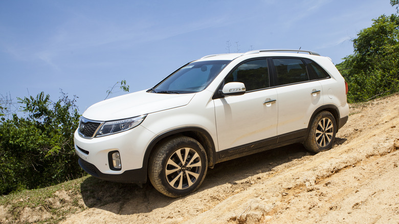 white Kia Sorento on a rough road