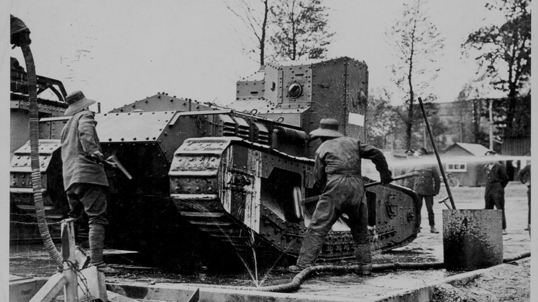 Soldiers cleaning Whippet tank