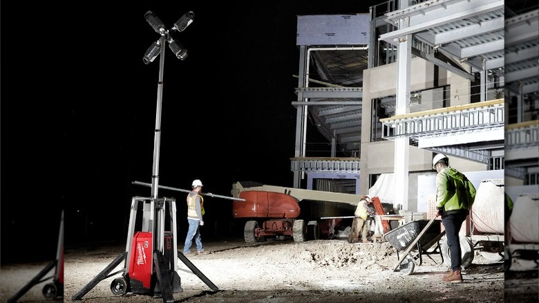 People working under light