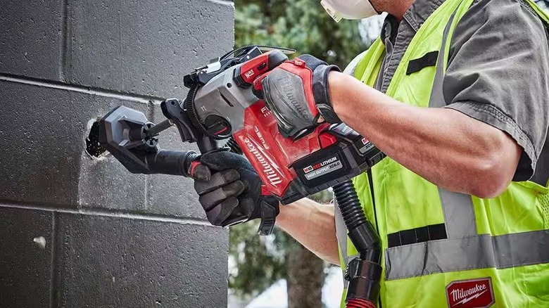 Milwaukee SDS hammer drilling into wall