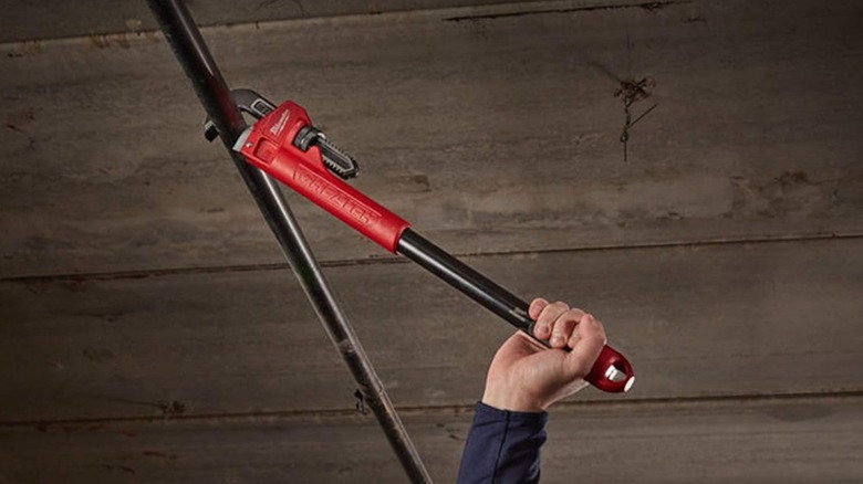 Cheater Steel Adaptable Pipe Wrench being used on a pipe