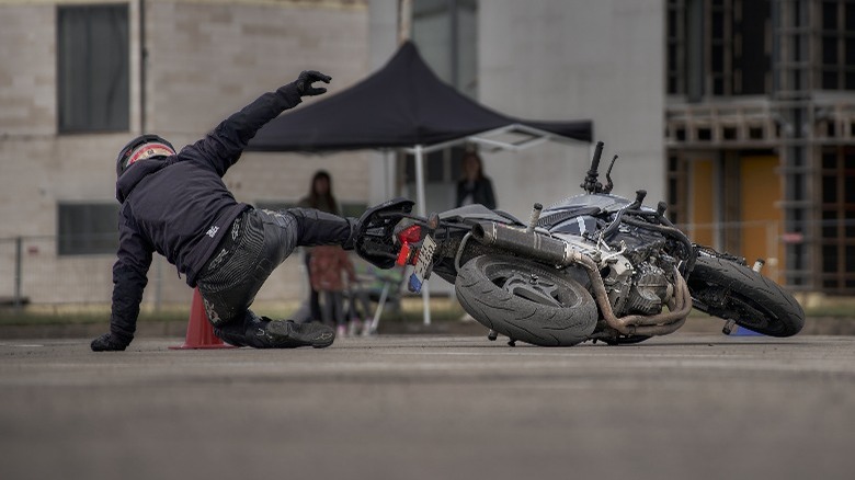 person falling off motorcycle