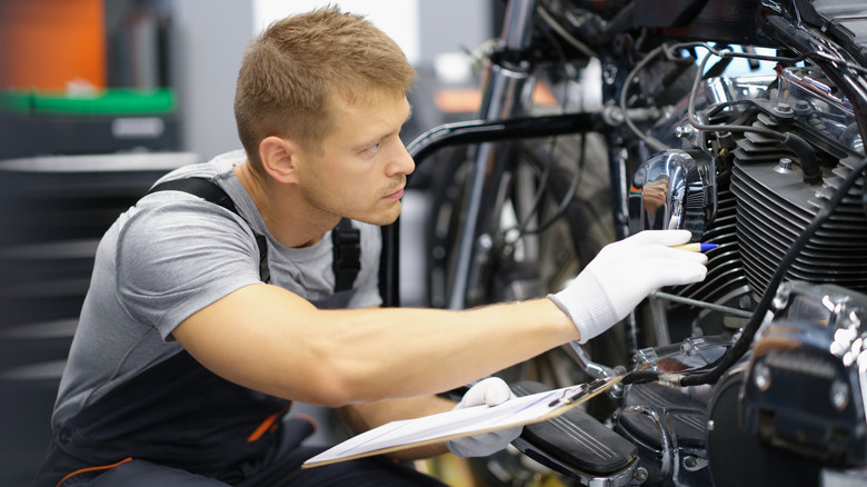 Motorcycle Mechanic Doing Maintenance