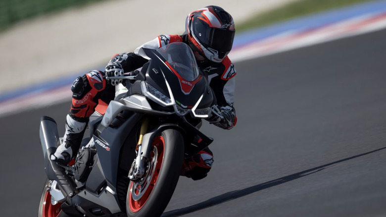 Black, grey, and red Aprilia RSV4 1100 on the race track