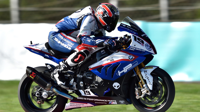 Red, white, and blue colored BMW S1000 RR on the race track