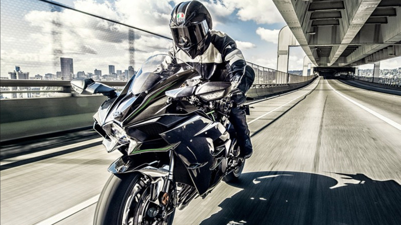 Black and green Kawasaki Ninja H-2 on the highway