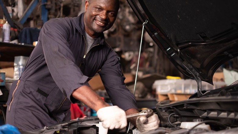 mechanic working on car