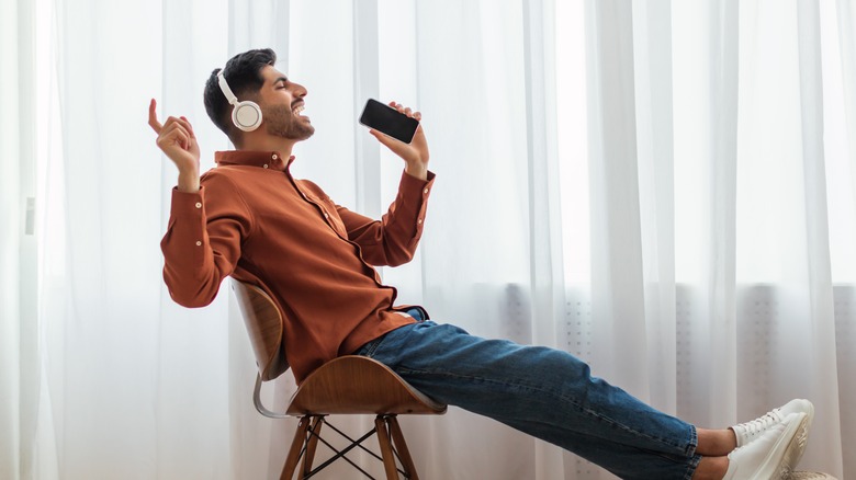 Man singing karaoke with phone